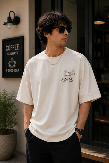 Cute Peeking Bunny Graphic Embroidered Oversized T-Shirt for Men in Off White | STITCHIFLY